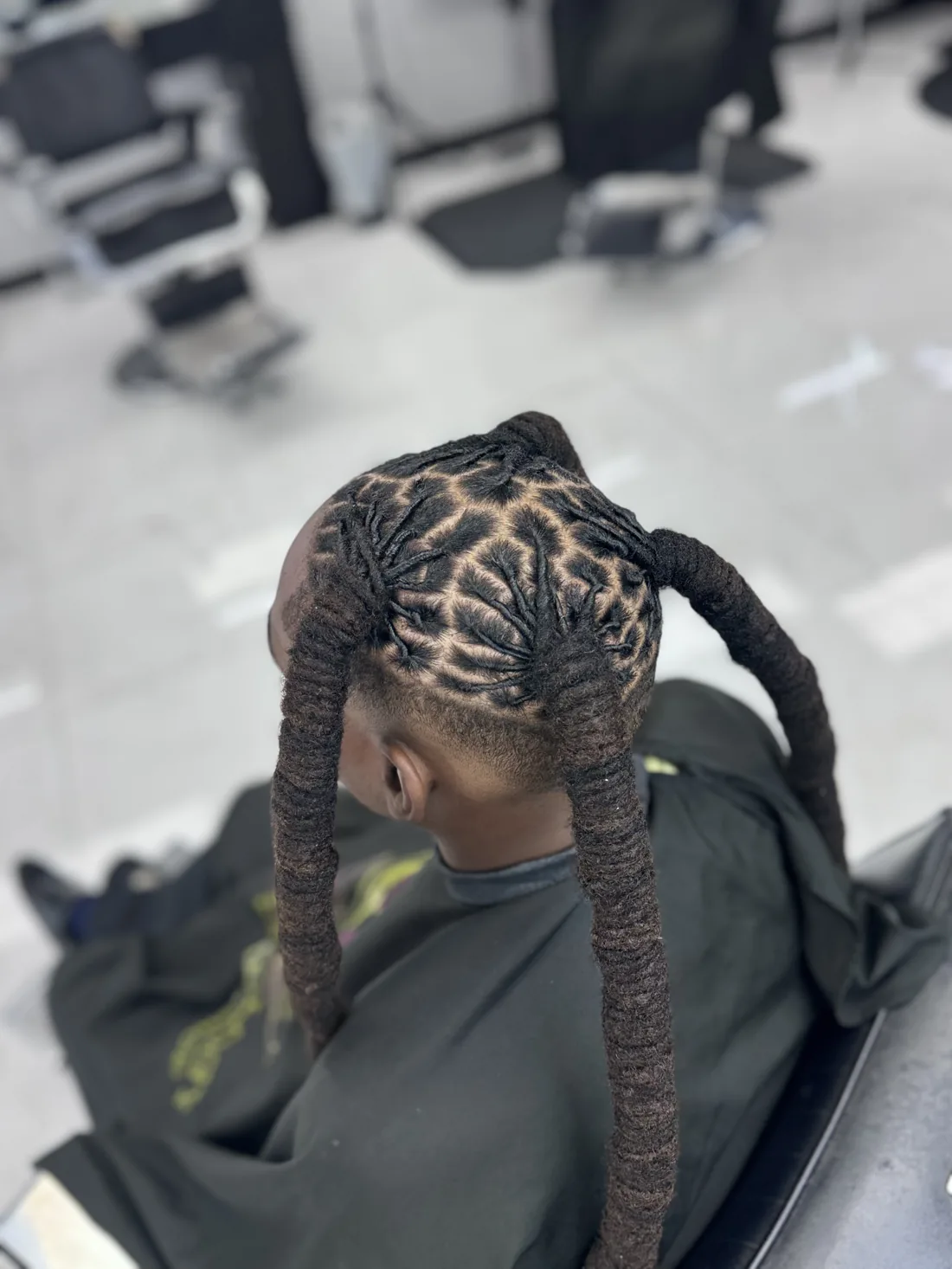Styled locs by a Tampa barber at Kings Kare
